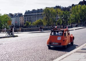 orange vehicle running on park